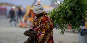 man selling neem leaves