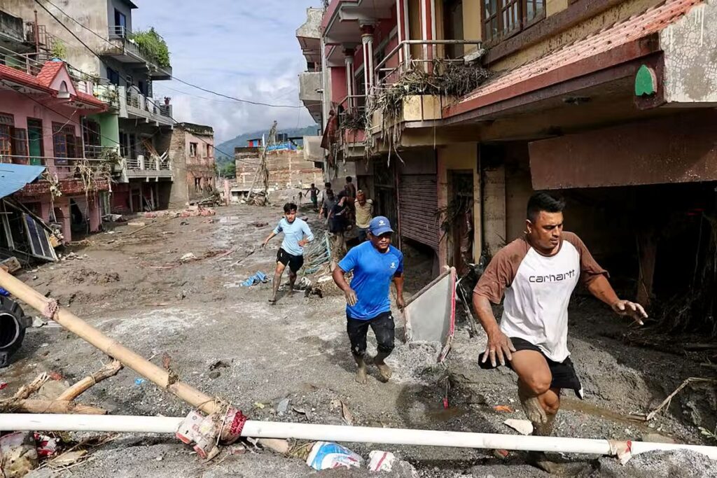 Nepal residents run flood