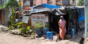 woman outside Mumbai's informal settlements