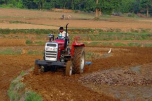 man on tractor Indian farms